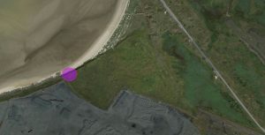 A google earth map with pink spot