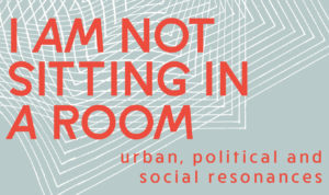 red test on grey and white lined background "I am not sitting in a room - urban, political and social resonances"